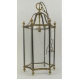 HANGING HALL LANTERN, Regency style, brass framed with six concave glass panels, open dome top and