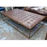 OKA WALLACE COFFEE TABLE/OTTOMAN, brass coloured framed with a padded, deep buttoned top upholstered