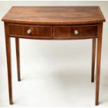 WRITING TABLE, George III mahogany and boxwood lined, bowfronted with two drawers, 86cm x 52cm x