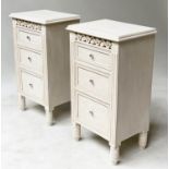 BEDSIDE CHESTS, a pair, French style grey painted each with pierced frieze and three graduated