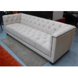 EICHHOLTZ PAOLO SOFA, studded with deep buttoned natural upholstery, 230cm L x 73cm H x 88cm D.