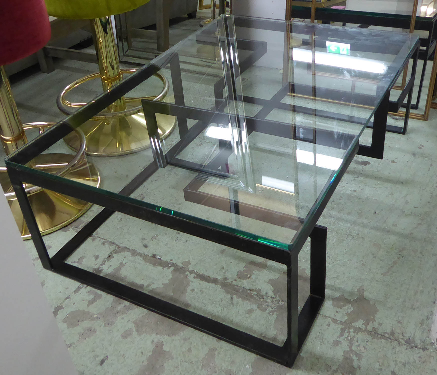 LOW TABLE, the glass top on a metal base of geometric form, 80cm D x 120cm W x 38cm H.