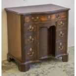 SERPENTINE KNEEHOLE DESK, George III mahogany with seven drawers and recessed door, 82cm H x 85cm