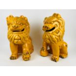 DOGS OF FOO, a pair, Chinese imperial yellow crackle glazed ceramic, approx 47cm H. (2)