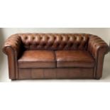 CHESTERFIELD SOFA, Victorian style faded tobacco brown leather with rounded and buttoned back and