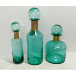 MURANO STYLE GLASS DECANTERS, a graduated set of three, 55cm at tallest. (3)