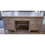 DESK, Louis XV style limed oak with five drawers and two doors, 80cm H x 167cm W x 68cm D.