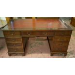 PEDESTAL DESK, Georgian style mahogany with red leather top above eight drawers, 77cm H x 153cm W