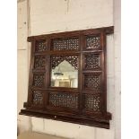 WALL MIRROR, decorative Moroccan pierced hardwood frame with a mihrab design mirror plate, 91cm H