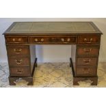 PEDESTAL DESK, Georgian style mahogany with green leather top above eight drawers, 74cm H x 122cm