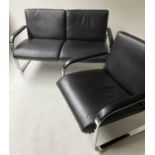 BOSS SOFA, 137cm W, black leather and chrome framed together with a matching armchair, 74cm W. (2)