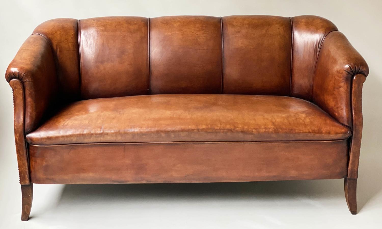 ART DECO SOFA, natural brown leather and brass studded with piping and shaped supports, 160cm W.