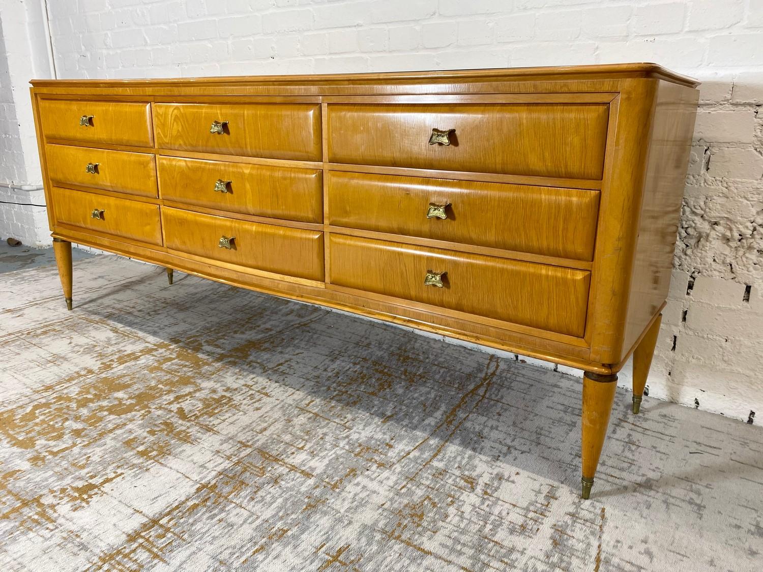 MANNER OF PAOLO BUFFA SIDEBOARD, 1950's Italian, with an arrangement of nine drawers and a leaf