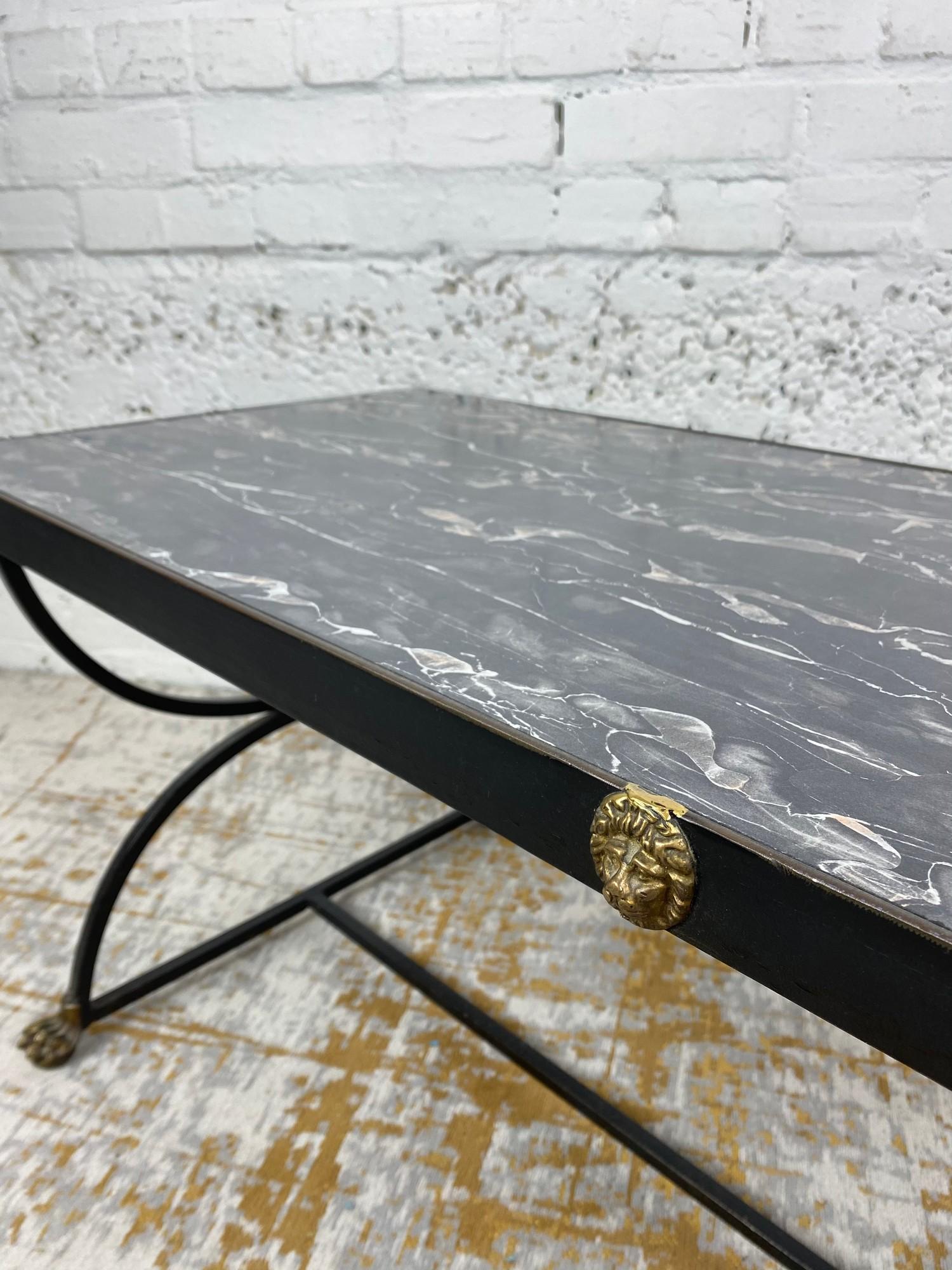 LOW TABLE, Regency design, simulated marble top above a steel base with brass lion head detail and - Image 5 of 7