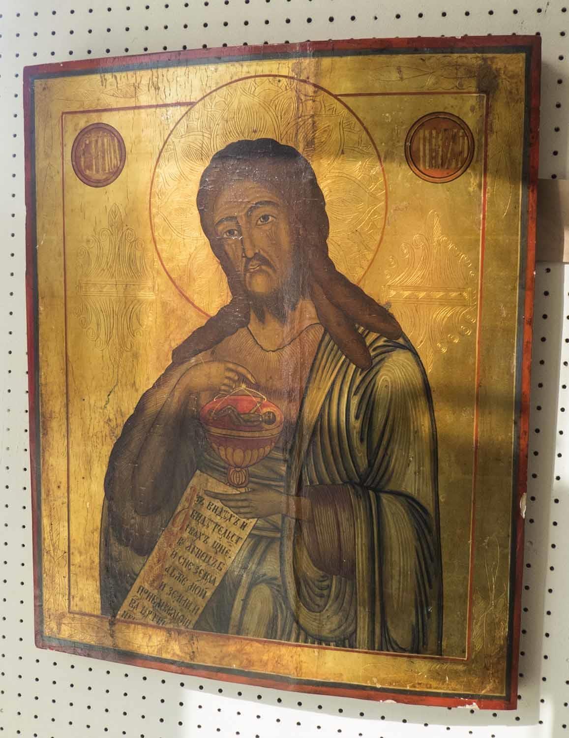 RUSSIAN ICON 'St John with Cup of Christ', tempera, gilt and gesso on wood, 54cm x 44cm.