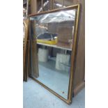 WALL MIRROR, with a gilt frame and floating plate, 124cm x 146cm.
