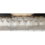 GLASSWARE, eight cut crystal patterned gilded tops, two sets of four, 18cm H and 16cm H. (8)