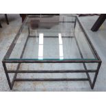 LOW TABLE, the glass top on a wrought metal base, 40cm H x 90cm x 132cm L.