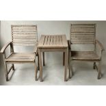 GARDEN ARMCHAIRS, a pair, weathered slatted teak together with a matching table, 76cm x 50cm x
