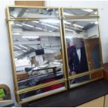 WALL MIRRORS, a pair, 1960's French style, gilt metal frames, 81cm x 51cm. (2)