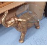 ELEPHANT SIDE TABLE, sculptural gilt base, glass top, 63cm H x 73cm x 45cm.