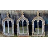 ARCHITECTURAL WALL MIRRORS, a set of three, Gothic revival style. (3)