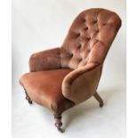 ARMCHAIR, Victorian walnut with brown velvet buttoned upholstery, turned front feet and stamped
