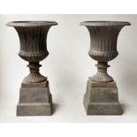 GARDEN URNS, a pair, vintage cast metal egg and dart, fluted vase and raised plinth, 37cm W x 70cm