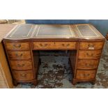 PEDESTAL DESK, walnut with a divided leather top above nine drawers, 116cm W x 75cm H x 61cm D.