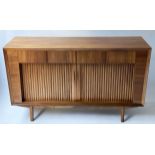 SIDEBOARD, 1970's Danish style teak with four short drawers above a pair of tambour sliding doors,