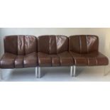 CHAIRS, a set of three, 1960's ribbed tan leather with chrome supports, 66cm W. (3)