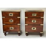 CAMPAIGN BEDSIDE CHESTS, a pair, 19th century mahogany campaign style brass bound each with three