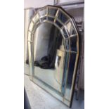 WALL MIRROR, Italian, of arched form with two bevelled plated borders, one clear, one blue, 88cm x