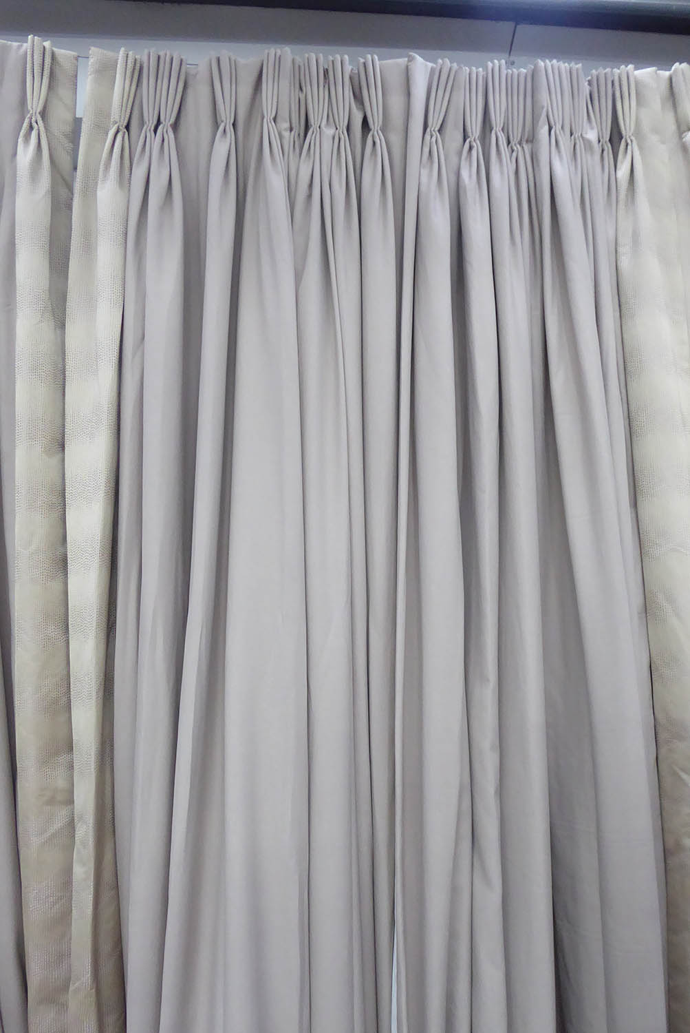 CURTAINS, two pairs, with a patterned leading edge, lined and interlined, one pair each curtain