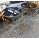 SIDE TABLES, a pair, 1950's atomic style, black laminate tops, 61cm H x 48cm diam. (2)