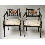 ARMCHAIRS, a pair, Regency style black lacquered and parcel gilt decorated with cane panelled