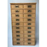 BANK OF DRAWERS, 19th century pine with two banks of ten drawers with recessed brass handles,