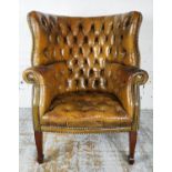 BARREL BACK WING ARMCHAIR, Edwardian with distressed olive green leather upholstery on square
