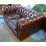 CHESTERFIELD SOFA, two seater, with studded decoration and buttoned brown leather upholstery,