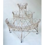 PLANT STAND, Victorian wirework of three semi circular graduated tiers, scrollwork distressed