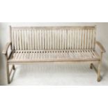 GARDEN BENCH, weathered teak of slatted construction with curved arms, 160cm W.