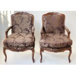 FAUTEUILS, a pair, French Louis XV style, stained walnut, with two tone brown leaf silk
