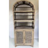 CANE BOOKCASE, rattan bamboo and cane bound with wicker panels each arched with shelves and