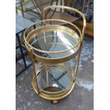 DRINKS TROLLEY, 1960's French style, gilt metal and mirror, 76.5cm H x 45cm Diam.