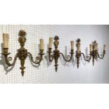 WALL LIGHTS, a set of four, late 19th/early 20th century French, gilt metal with vase and acanthus