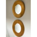 WALL MIRRORS, a pair, circular with broad giltwood frames, 60cm W. (2)