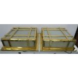 WALL LIGHTS, a pair, gilt metal with frosted glass, 48cm x 48cm x 16cm approx. (2)