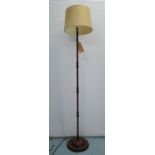 FLOOR STANDING LAMP, with a turned column and a shade, 176cm H.