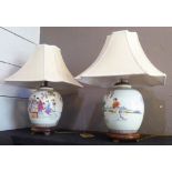 CHINESE LAMPS, a pair, polychrome porcelain with shades, 57cm H including shades. (2) (with faults)