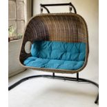 GARDEN SWING, outdoor use, grey plasticised basketwork, with blue cushions and floor standing frame,